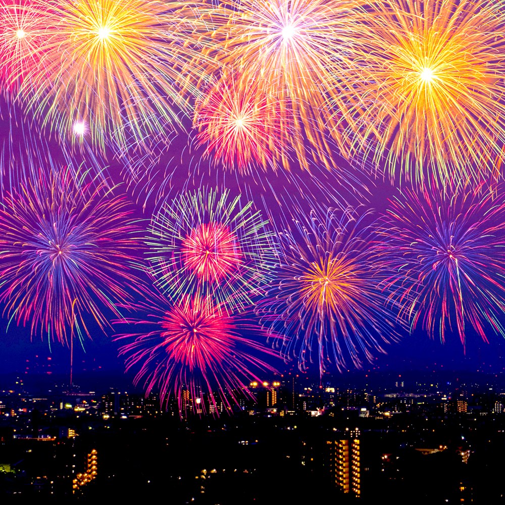 Colourful fireworks over a city at night