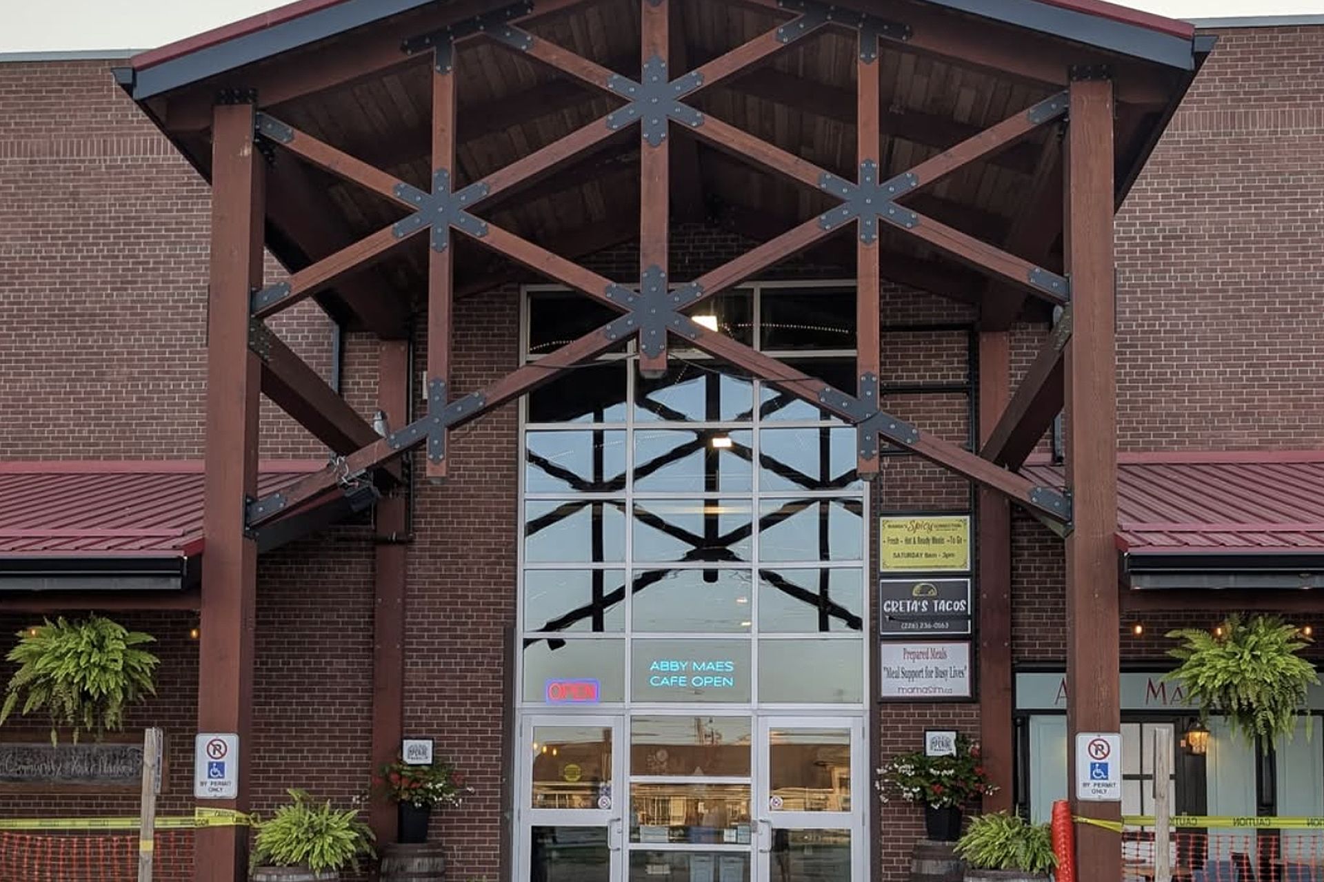 The Old Imperial Market entrance, with its timber truss canopy and brick facade