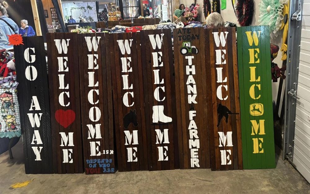 Painted wooden welcome boards