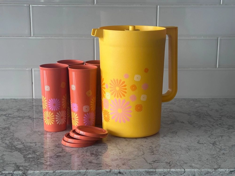 A Tupperware pitcher and tumblers