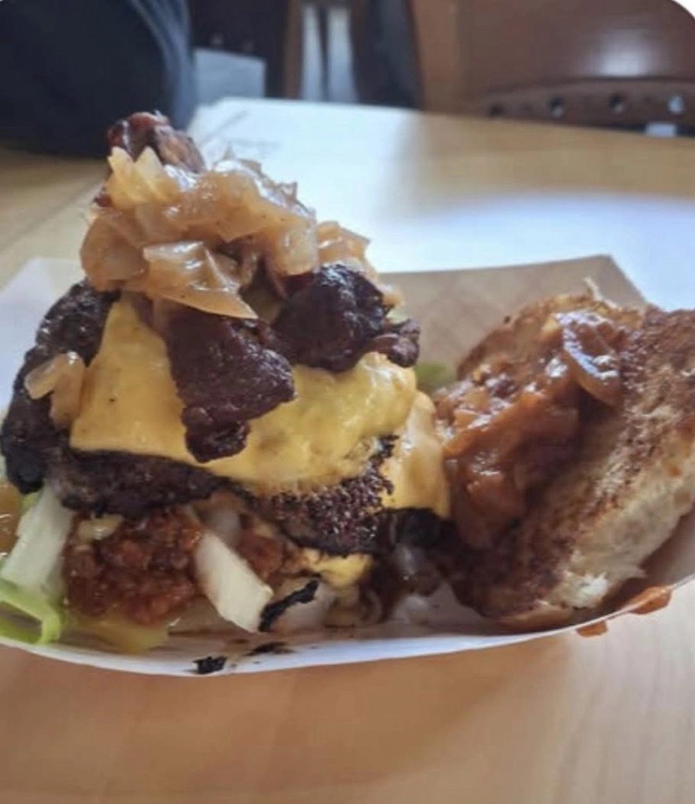 A smashburger with grilled onions and cheese