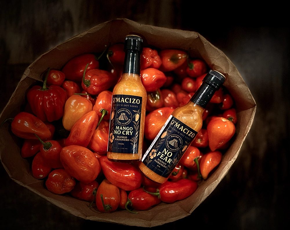 Q’Macizo sauces in a bag of fresh peppers