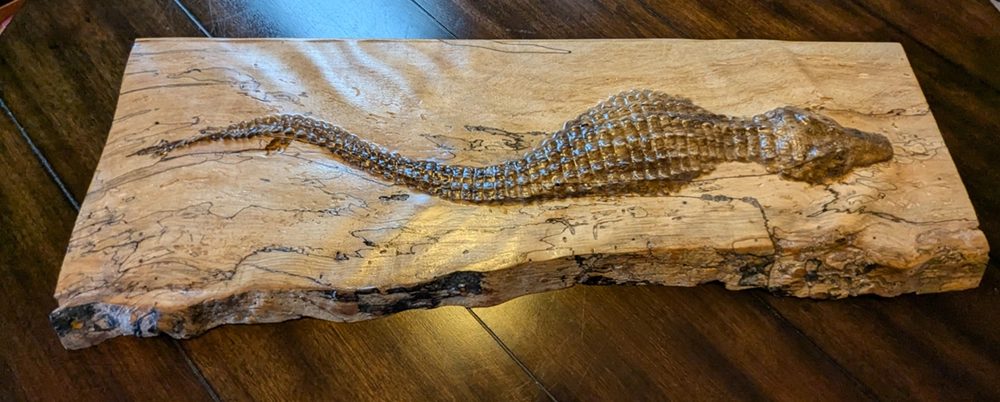 A carved hardwood panel