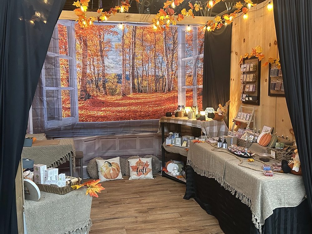 The Wax On, Stress Off booth decorated for fall